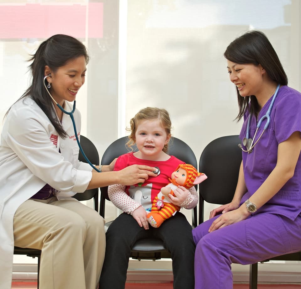 Doctor and nurse with child
